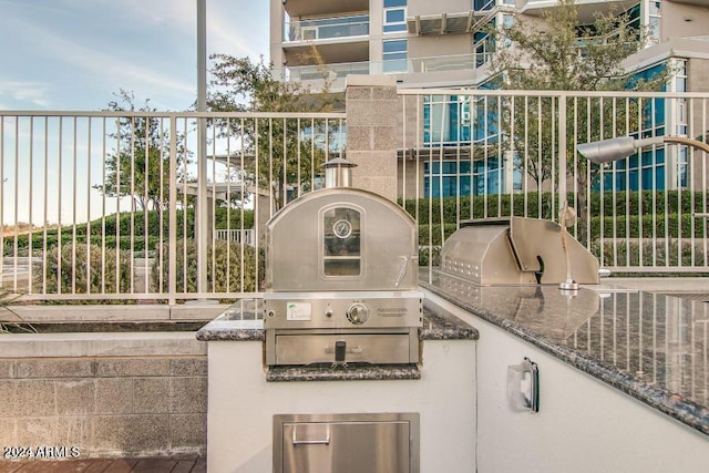 view of patio with grilling area and exterior kitchen