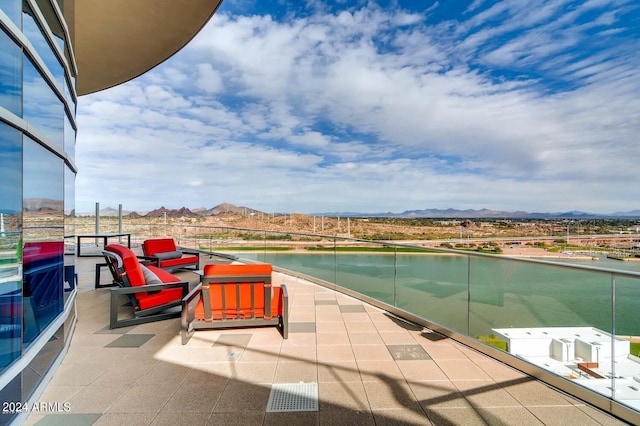 balcony with a water and mountain view