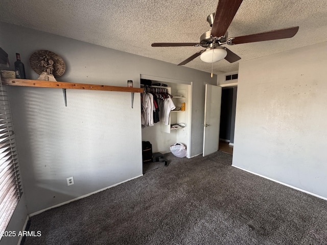 unfurnished bedroom with carpet flooring, a closet, a textured ceiling, and a ceiling fan