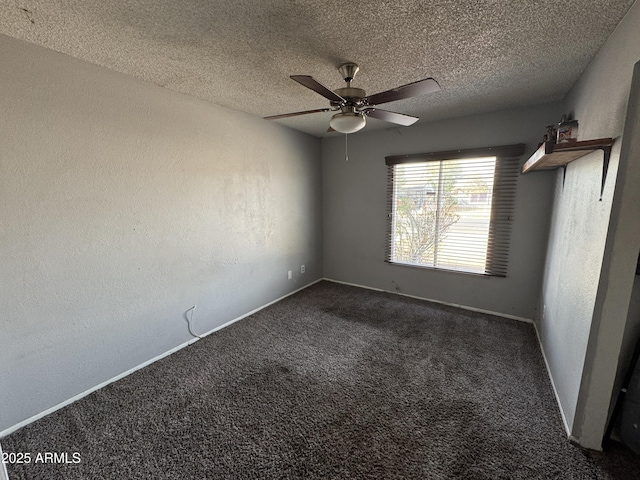 carpeted empty room featuring a ceiling fan, a textured ceiling, and baseboards
