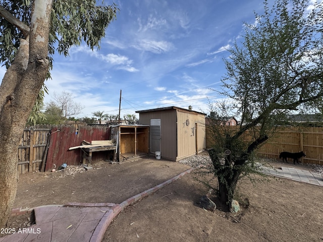 view of shed with a fenced backyard