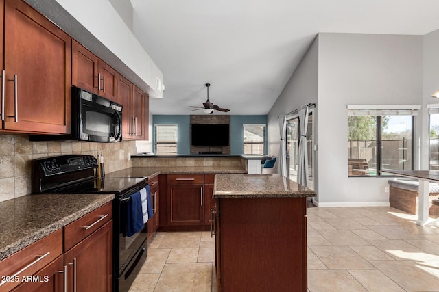 kitchen with ceiling fan, light tile patterned floors, decorative backsplash, a center island, and black appliances