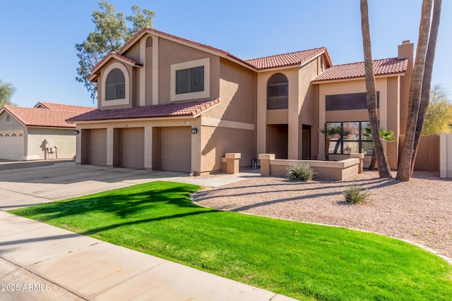 mediterranean / spanish-style home featuring concrete driveway, an attached garage, a tiled roof, and stucco siding