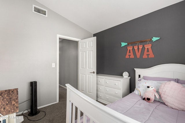 bedroom with vaulted ceiling, dark carpet, visible vents, and baseboards