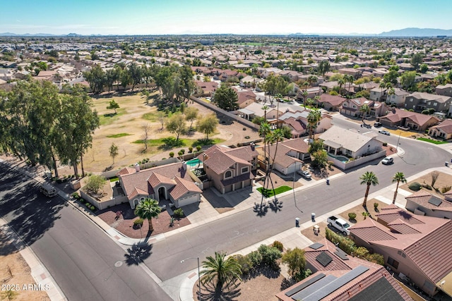 drone / aerial view featuring a residential view and a mountain view