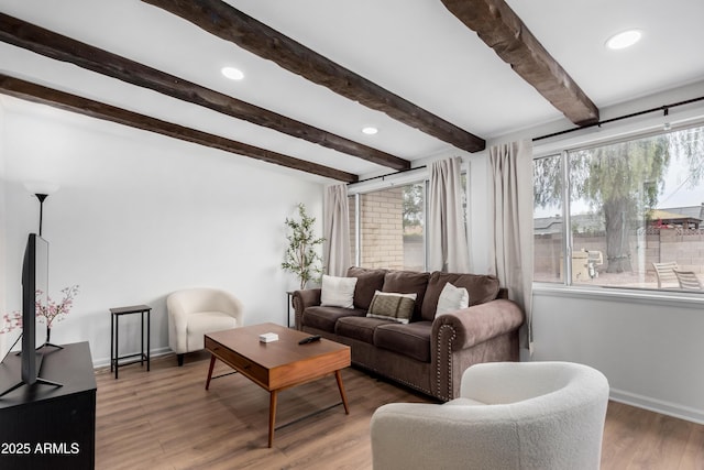 living room with recessed lighting, dark wood-style flooring, beamed ceiling, and baseboards