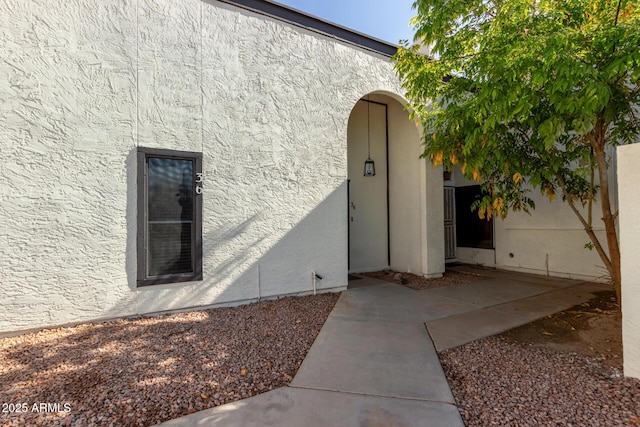 doorway to property with a patio area