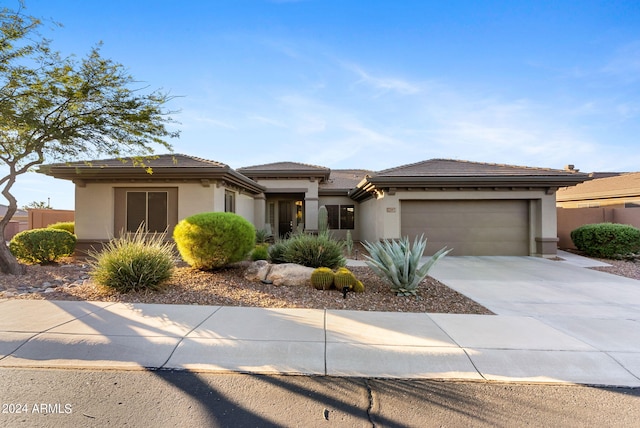 prairie-style house featuring a garage