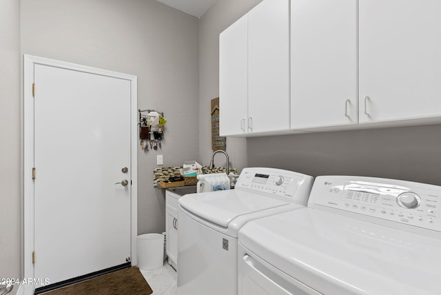 laundry room with cabinets and independent washer and dryer