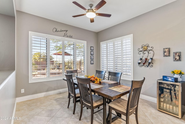 dining room with light tile patterned floors and ceiling fan