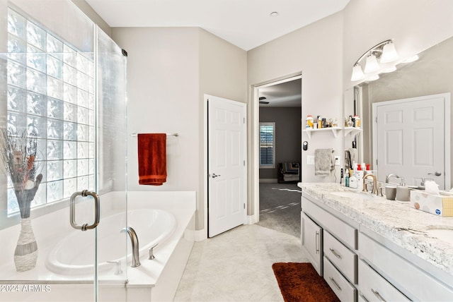 bathroom with tile patterned floors, vanity, and independent shower and bath