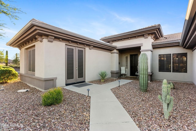 entrance to property featuring french doors