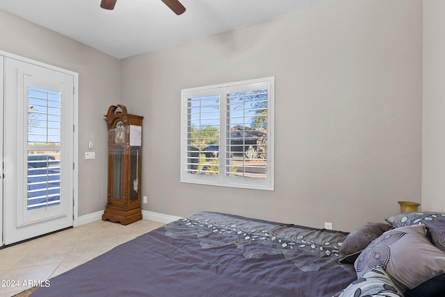 bedroom featuring ceiling fan and light tile patterned flooring