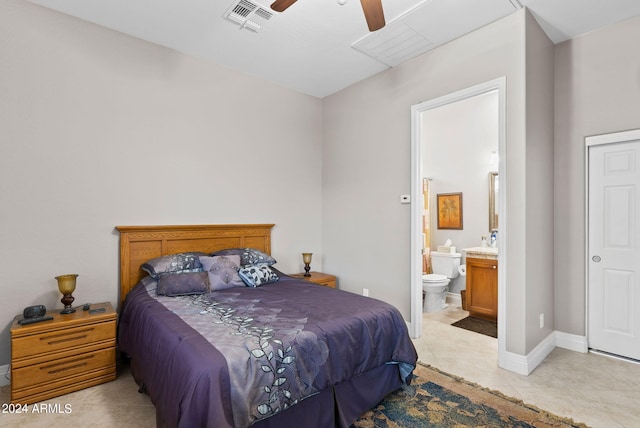 bedroom with ensuite bath, ceiling fan, and light tile patterned floors