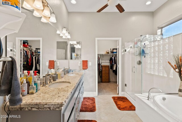 bathroom featuring tile patterned floors, vanity, ceiling fan, and shower with separate bathtub