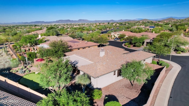 birds eye view of property with a mountain view