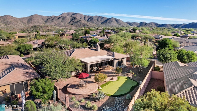 birds eye view of property featuring a mountain view