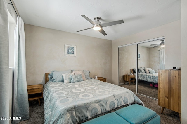 carpeted bedroom with a closet and ceiling fan