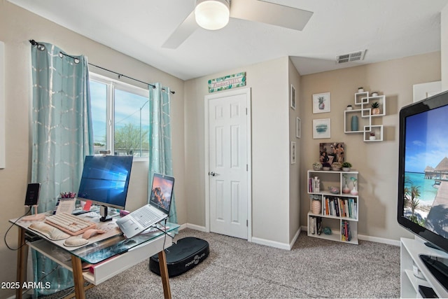 office area featuring baseboards, visible vents, ceiling fan, and carpet floors