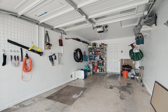garage featuring baseboards and a garage door opener