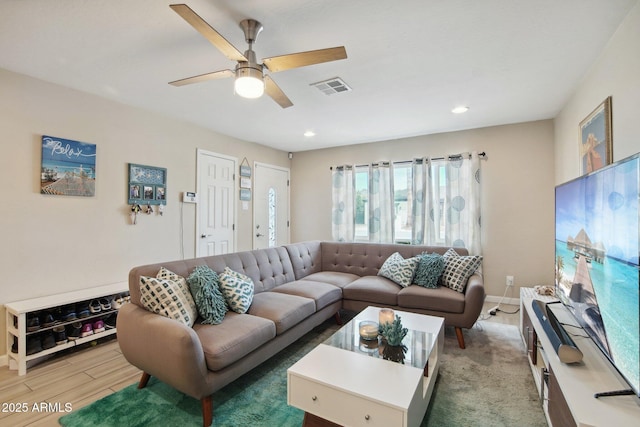 living area featuring recessed lighting, baseboards, ceiling fan, visible vents, and wood finished floors