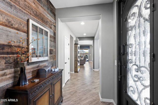 entryway featuring light wood finished floors and baseboards