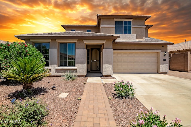 11936 W Alvarado Rd, Avondale, AZ 85392 - prairie-style home featuring stucco siding, driveway, and an attached garage