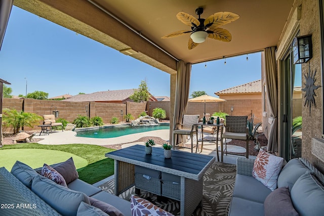 11936 W Alvarado Rd, Avondale, AZ 85392 - fenced backyard featuring an outdoor living space, a patio area, and a ceiling fan