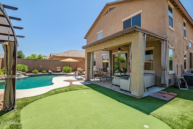 11936 W Alvarado Rd, Avondale, AZ 85392 - view of pool featuring a putting area, a patio, a fenced backyard, and a ceiling fan