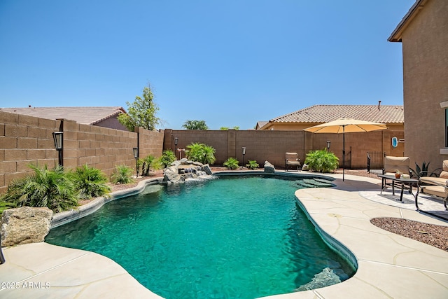 11936 W Alvarado Rd, Avondale, AZ 85392 - view of swimming pool featuring a fenced backyard and a patio area