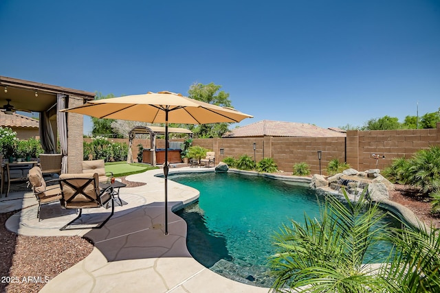 11936 W Alvarado Rd, Avondale, AZ 85392 - view of swimming pool featuring a hot tub, a patio, a fenced backyard, and a ceiling fan
