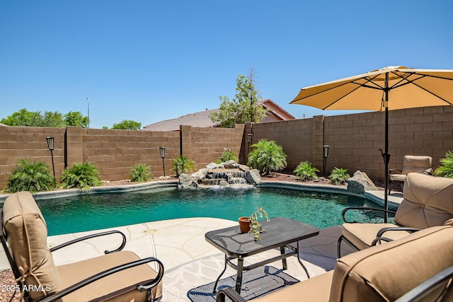 11936 W Alvarado Rd, Avondale, AZ 85392 - view of swimming pool with a patio