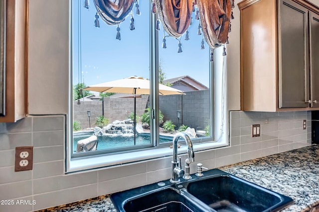 11936 W Alvarado Rd, Avondale, AZ 85392 - kitchen with tasteful backsplash and stone countertops
