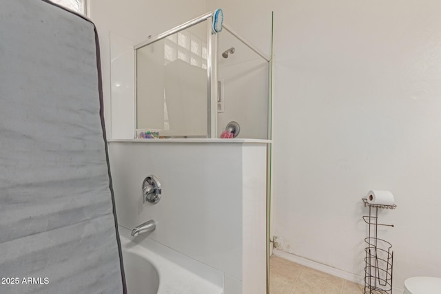 bathroom featuring a bathtub, a shower with door, toilet, and tile patterned floors