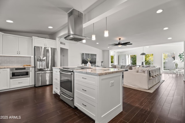 kitchen featuring white cabinetry, appliances with stainless steel finishes, light stone counters, and island range hood