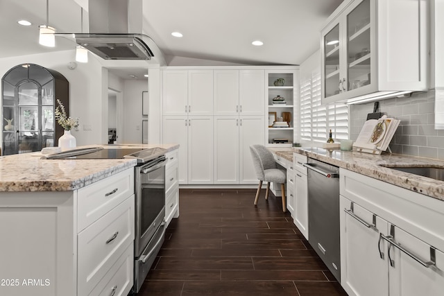 kitchen featuring light stone countertops, white cabinetry, and appliances with stainless steel finishes