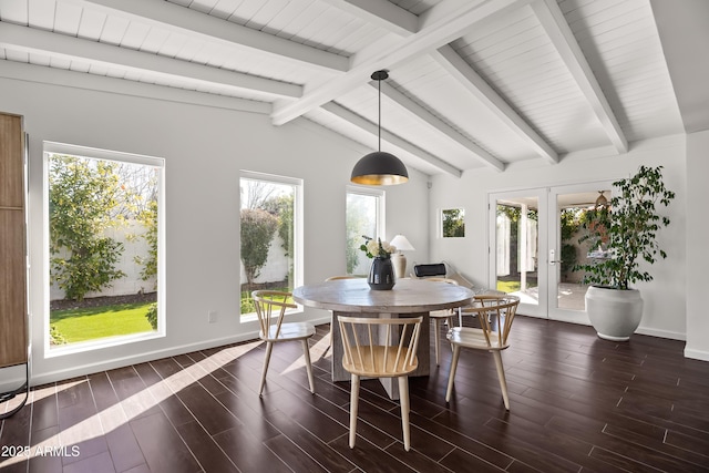 dining room with a healthy amount of sunlight, vaulted ceiling with beams, dark hardwood / wood-style flooring, and french doors