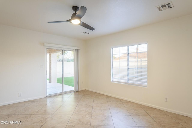 2925 E Dragoon Ave, Mesa, AZ 85204 - empty room with plenty of natural light and a ceiling fan
