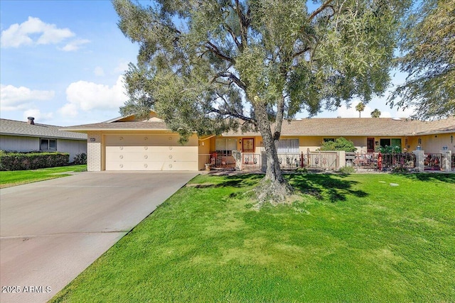 ranch-style house with a garage and a front yard