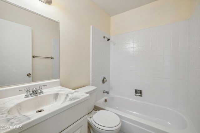 bathroom with shower / washtub combination, toilet, and vanity