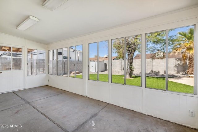 unfurnished sunroom featuring a healthy amount of sunlight