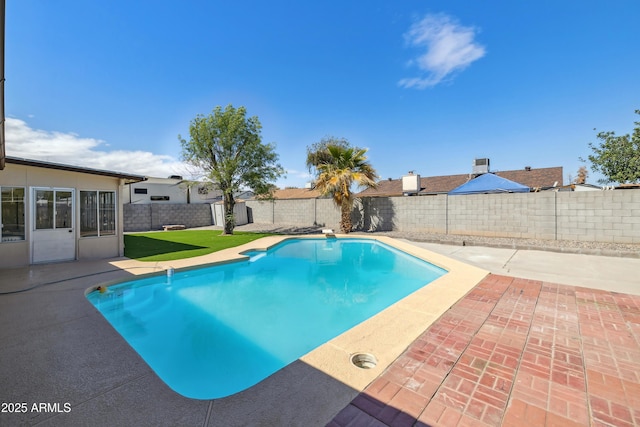 view of swimming pool with a fenced in pool, a patio, and a fenced backyard