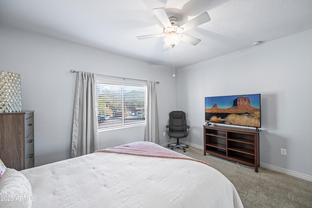 carpeted bedroom featuring a ceiling fan and baseboards