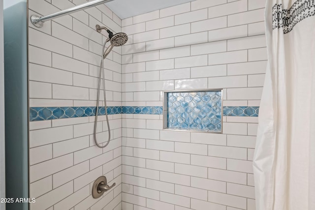 full bathroom with a tile shower