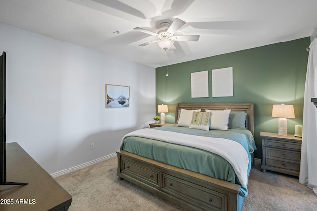 bedroom featuring baseboards, carpet floors, and a ceiling fan