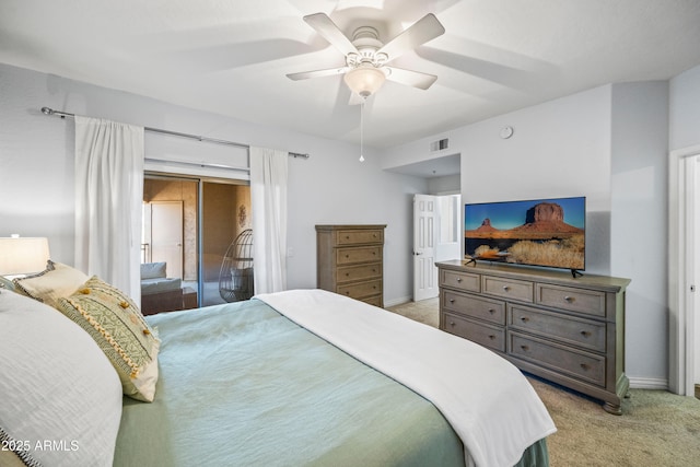 bedroom featuring visible vents, light colored carpet, baseboards, and access to outside