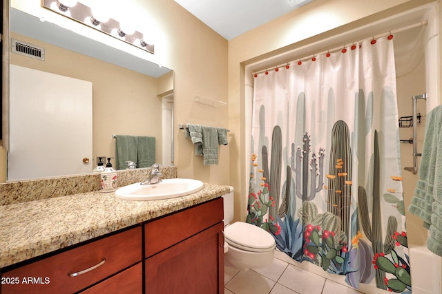 bathroom featuring vanity, tile patterned floors, toilet, and visible vents