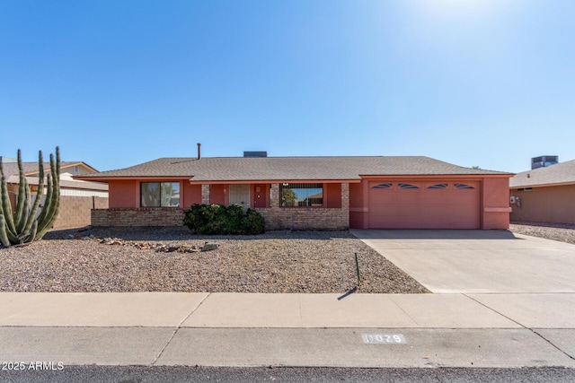 single story home with a garage