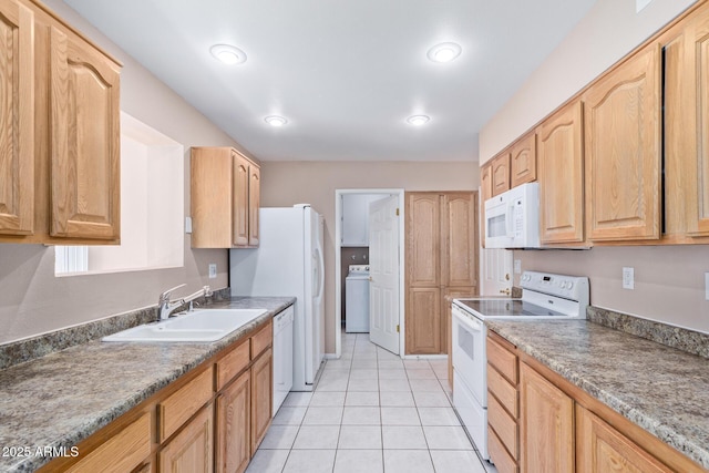 kitchen with sink, white appliances, light tile patterned flooring, light brown cabinetry, and washer / dryer