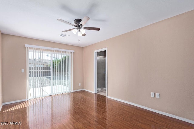 unfurnished room with ceiling fan and dark hardwood / wood-style floors